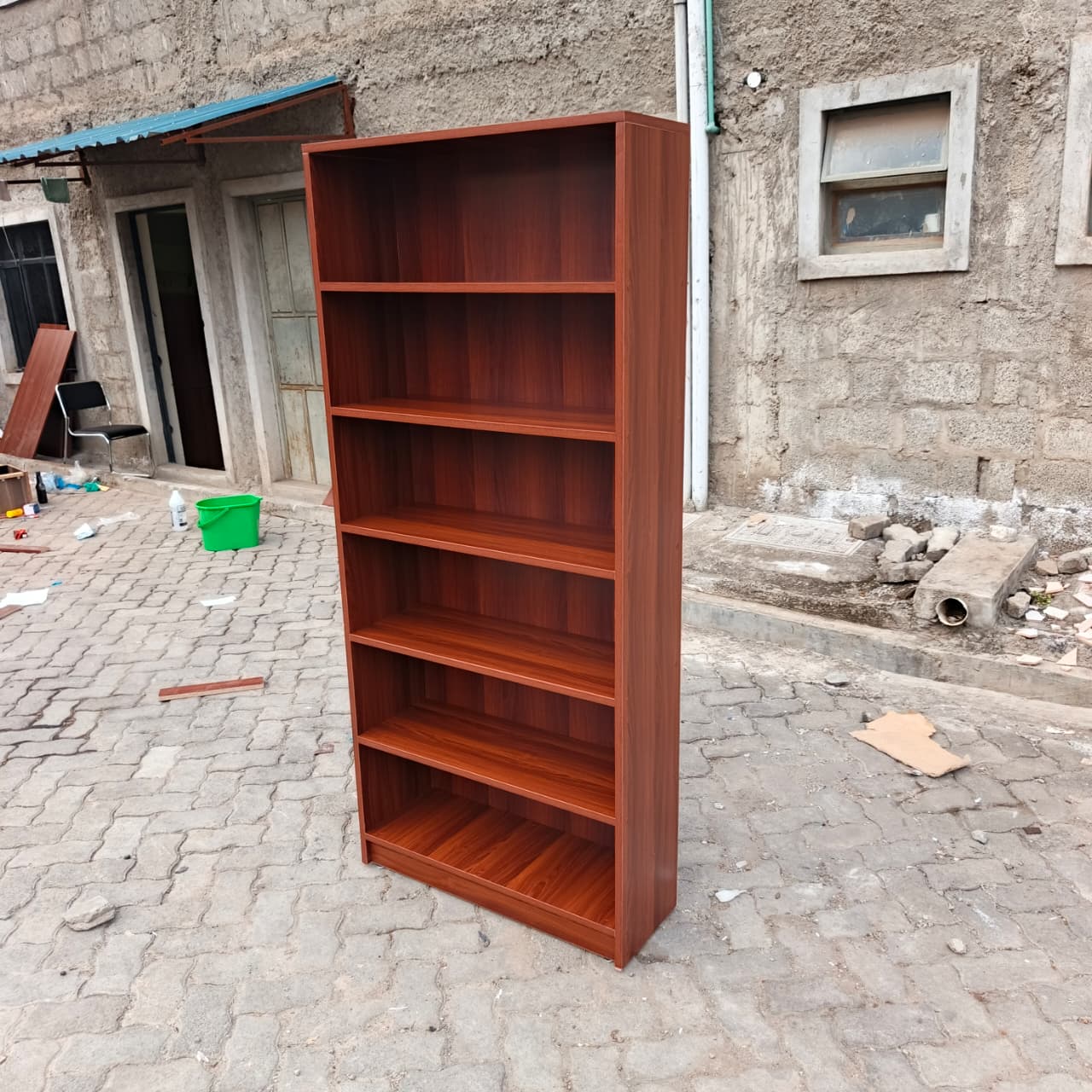 red brown bookshelf, six tier bookshelf, 6 tier bookcase, modern bookshelf, modern bookcase, wooden bookshelf, wooden bookcase, red brown bookcase, dark wood bookshelf, six shelf bookcase, tall bookshelf, tall bookcase, storage bookshelf, storage bookcase, display bookshelf, display bookcase, open shelf bookcase, open bookshelf, contemporary bookshelf, contemporary bookcase, minimalist bookshelf, minimalist bookcase, home bookshelf, office bookshelf, study bookshelf, library bookshelf, book storage shelf, home storage shelves, office storage shelves, decorative bookshelf, stylish bookcase, modern storage unit, multipurpose bookshelf, durable bookshelf, heavy duty bookcase, high quality bookshelf, premium bookcase, affordable bookshelf, compact bookshelf, space saving bookcase, vertical storage shelf, ladder style bookshelf, rectangular bookshelf, shelving unit modern, book organizer shelf, office book storage, study room bookshelf, bedroom bookshelf, living room bookshelf, bookshelf furniture Kenya, bookcase Nairobi, bookshelf Nairobi, wooden shelves Kenya, office bookshelf Kenya, home bookshelf Nairobi, study shelf Kenya, bookcase suppliers Nairobi, bookshelf for sale Kenya, bookcase deals Nairobi, cheap bookshelf Kenya, affordable bookcase Nairobi, premium bookshelf Kenya, modern bookshelf Kenya, bookcase showroom Nairobi, buy bookshelf Kenya, bookshelf online Nairobi, storage shelves Kenya, workspace shelves Nairobi, home furniture bookshelf Kenya, office furniture bookshelf Nairobi, library shelves Kenya, bookcase delivery Nairobi, shelving unit Kenya, modern shelving Nairobi, book rack Kenya, wooden book rack Nairobi, tall shelf Kenya, storage rack Nairobi, bookcase near me Kenya, Nairobi furniture shop bookshelf, Kenya furniture store bookcase, bookshelf best Kenya, bookcase high quality Nairobi, modern shelving unit Kenya, decorative shelf Nairobi, stylish bookshelf Kenya, elegant bookcase Nairobi, durable shelving Kenya, strong bookshelf Nairobi, vertical storage Nairobi Kenya, compact shelving Kenya, modern home decor shelf Nairobi, office decor bookshelf Kenya.